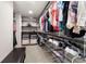 Walk-in closet features shelving, hanging racks, and a bench seat at 1181 Gateview Dr, Lawrenceville, GA 30046