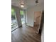 Bright bedroom with hardwood floors, a ceiling fan, and natural light from two large windows at 1276 Longreen Terrace Nw # 115, Atlanta, GA 30318