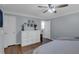 Spacious bedroom with ample closet space, hardwood flooring, and a ceiling fan at 141 Weatherstone Dr, Woodstock, GA 30188