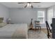 Cozy bedroom with a comfortable bed, neutral colors, and a window view at 141 Weatherstone Dr, Woodstock, GA 30188