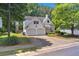 Charming two-story home with a two-car garage and well-maintained landscaping at 141 Weatherstone Dr, Woodstock, GA 30188