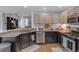 Well-lit kitchen featuring granite countertops, stainless steel appliances, and modern cabinetry at 141 Weatherstone Dr, Woodstock, GA 30188