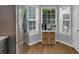 Bright breakfast nook with natural lighting and decorative basket storage below coffee bar at 141 Weatherstone Dr, Woodstock, GA 30188