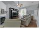 Comfortable living room featuring a fireplace, built-in shelving, and neutral décor at 141 Weatherstone Dr, Woodstock, GA 30188