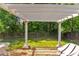 Backyard featuring a charming pergola perfect for outdoor entertaining and relaxation at 141 Weatherstone Dr, Woodstock, GA 30188