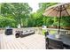 Spacious back deck with ample seating and dining areas, perfect for outdoor entertaining at 1486 Brooklyn Nw Ave, Atlanta, GA 30309