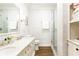 Bathroom with marble countertops, a walk-in shower, and patterned wallpaper at 1486 Brooklyn Nw Ave, Atlanta, GA 30309