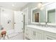 Nicely decorated bathroom with vanity, sink, tub, and geometric wallpaper at 1486 Brooklyn Nw Ave, Atlanta, GA 30309