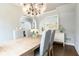 Dining room features a modern chandelier, wood floors, and a stylish buffet at 1486 Brooklyn Nw Ave, Atlanta, GA 30309