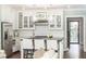 Kitchen and living area view. Includes stainless steel appliances, white cabinets, and island seating at 1486 Brooklyn Nw Ave, Atlanta, GA 30309