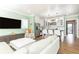 Open floor plan showcasing living area with kitchen view, and a wall-mounted TV at 1486 Brooklyn Nw Ave, Atlanta, GA 30309