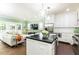 Open concept kitchen and living room with comfortable seating and plenty of natural light at 1486 Brooklyn Nw Ave, Atlanta, GA 30309