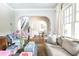 Spacious living room with arched doorways, hardwood floors, and elegant furnishings at 1486 Brooklyn Nw Ave, Atlanta, GA 30309