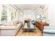 Bright and airy living room featuring a fireplace, large windows, and comfortable seating at 1486 Brooklyn Nw Ave, Atlanta, GA 30309