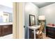 Small light blue office space featuring a small writing desk and an adjacent bathroom at 1486 Brooklyn Nw Ave, Atlanta, GA 30309