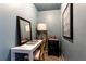 Small light blue office space featuring a white writing desk and a black side table at 1486 Brooklyn Nw Ave, Atlanta, GA 30309