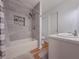 Modern bathroom with tiled shower and tub, niche, and wooden floors at 2610 Cumberland Ct, Smyrna, GA 30080