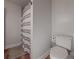Bathroom featuring tile floor, toilet, and shower with grey and white striped shower curtain at 2610 Cumberland Ct, Smyrna, GA 30080