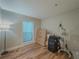 Neutral bedroom with hard surface flooring, a window, and natural light at 2610 Cumberland Ct, Smyrna, GA 30080