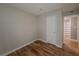 Bright bedroom with neutral walls and wood-look flooring, and a closet visible at 2610 Cumberland Ct, Smyrna, GA 30080