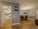 Cozy dining area with hardwood floors and seating for four adjacent to a kitchen with stainless appliances at 2610 Cumberland Ct, Smyrna, GA 30080