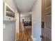 Welcoming entryway with hardwood flooring leads to the living area; features a mirror and coat rack at 2610 Cumberland Ct, Smyrna, GA 30080