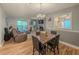 Open-plan living space featuring a fireplace, wood floors, and furniture at 2610 Cumberland Ct, Smyrna, GA 30080