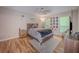 Well-lit main bedroom featuring a ceiling fan, modern furnishings, and decor at 2610 Cumberland Ct, Smyrna, GA 30080