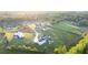 Aerial view showcasing a luxurious home and its manicured surroundings, exemplifying upscale suburban living at 5160 Howard Rd, Cumming, GA 30040