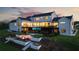Elegant home with a pool, fire pit, and landscaped backyard, perfect for outdoor entertaining and relaxation at 5160 Howard Rd, Cumming, GA 30040