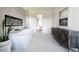 Bathroom featuring a sleek, modern tub, fireplace, large artwork, and stylish dark wood cabinet at 5160 Howard Rd, Cumming, GA 30040