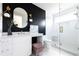 Modern bathroom featuring a glass shower, stylish fixtures, and a sleek vanity area at 5160 Howard Rd, Cumming, GA 30040
