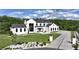 Beautiful modern farmhouse with a manicured lawn, stylish landscaping, and an inviting entrance at 5160 Howard Rd, Cumming, GA 30040