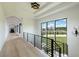 Bright hallway featuring hardwood floors, natural light, and views to the exterior at 5160 Howard Rd, Cumming, GA 30040