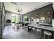 Spacious living room with high ceilings, modern finishes, bar, and large windows at 5160 Howard Rd, Cumming, GA 30040