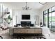 Bright living room with a fireplace, television, comfortable seating, and a decorative console table at 5160 Howard Rd, Cumming, GA 30040