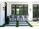 Outdoor bar featuring modern seating, black trimmed windows, and manicured turf at 5160 Howard Rd, Cumming, GA 30040