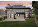 A home's exterior backyard featuring a well-maintained lawn, patio area and fencing at 1045 River Valley Dr, Dacula, GA 30019