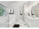 This bathroom features marble tile floors, a soaking tub, and a glass shower at 1045 River Valley Dr, Dacula, GA 30019