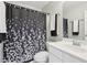This bathroom has a shower and tub combination with nice tiling at 1045 River Valley Dr, Dacula, GA 30019
