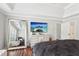 This bedroom has hardwood floors, a flat screen tv, and large mirror at 1045 River Valley Dr, Dacula, GA 30019