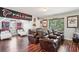 Bonus Room featuring reclining leather chairs and sports memorabilia at 1045 River Valley Dr, Dacula, GA 30019