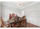 Elegant dining room featuring hardwood floors, a decorative chandelier, and formal seating at 1045 River Valley Dr, Dacula, GA 30019