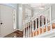 Inviting entryway featuring hardwood floors, a staircase, and abundant natural light at 1045 River Valley Dr, Dacula, GA 30019