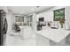 Modern kitchen with quartz countertops, stainless steel appliances, and a marble backsplash at 1045 River Valley Dr, Dacula, GA 30019