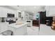 Open concept kitchen with granite countertops and eat-in island at 1045 River Valley Dr, Dacula, GA 30019