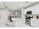 Open kitchen with an island, stainless steel appliances, and eat-in breakfast nook at 1045 River Valley Dr, Dacula, GA 30019
