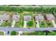 Aerial view of a two-story house with a well-maintained lawn and driveway in a suburban neighborhood at 1370 Sunnys Halo Dr, Suwanee, GA 30024