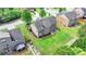Aerial shot of a home's backyard and lawn, featuring a well-maintained lawn and landscaping at 1370 Sunnys Halo Dr, Suwanee, GA 30024