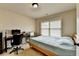 Bedroom with natural light and a desk area at 1370 Sunnys Halo Dr, Suwanee, GA 30024